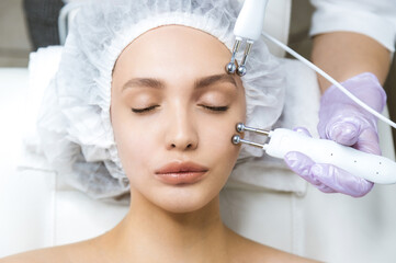 Woman at a beauticians appointment. Non-surgical face lifting.