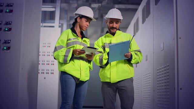 Engineer checking and inspecting at MDB panel , working with electric switchboard to check  medium Voltage Switchgear working in Main Distribution Boards factory.
