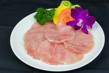 Fresh pork sirloin, thin slices Place in a dish with carrots and pumpkin.