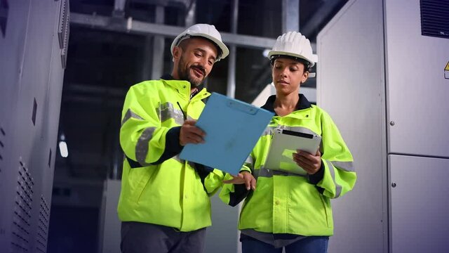 Engineer checking and inspecting at MDB panel , working with electric switchboard to check  medium Voltage Switchgear working in Main Distribution Boards factory.