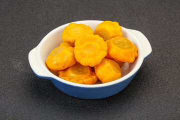 Marinated yellow patisson in the bowl