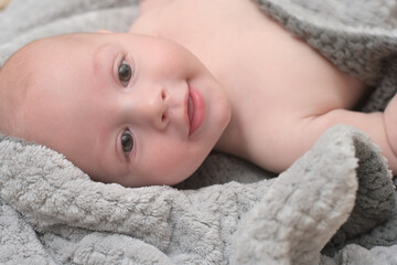 Cute smiling little baby after bath