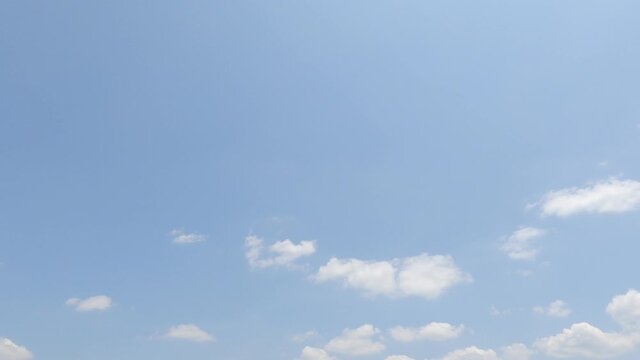 Puffy fluffy white cloud n cotton candy cumulus cloudscape moving on beautiful sunny clear blue sky background in summer sunlight n sun ray at sunshine day, slow motion 4k cinemagraph b-roll TimeLapse
