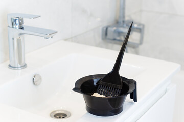 Hair coloring at home in the bathroom. Self-care in quarantine.