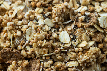 Close up of mix of unprocessed whole grains, chia, quinoa, nuts, seeds for texture background.