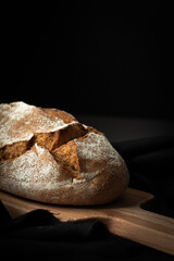 Healthy organic bread on the black towel