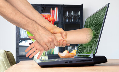Man pulling someone through the laptop screen