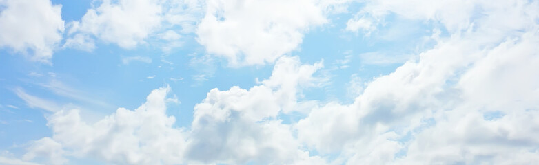 white clouds on blue sky background, abstract seasonal wallpaper, sunny day atmosphere