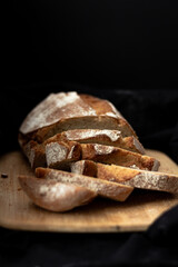 Healthy organic bread on the black towel