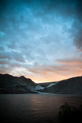 sunset over the 
water dam