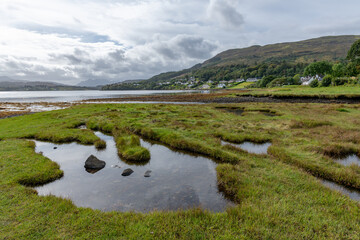 Fototapeta na wymiar The Bay of Lovely Muck in the town of Portree on the Isle of Skye in Scotland