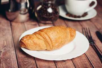 croissant in a plate on the table kitchenware breakfast meal dessert