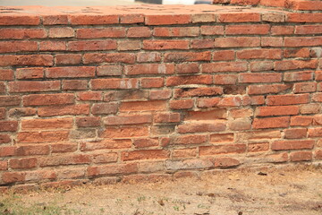 Old red brick wall in a background, texture.