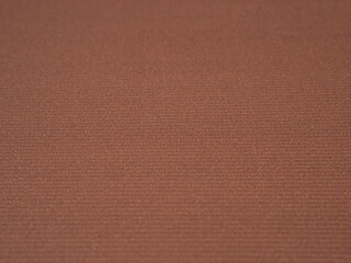 Empty brown colored corrugated background texture. The concept for image, text, design..