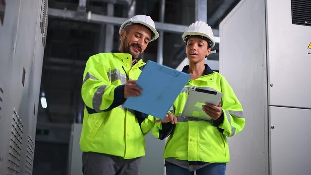Engineer checking and inspecting at MDB panel , working with electric switchboard to check  medium Voltage Switchgear working in Main Distribution Boards factory.