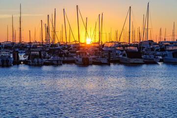 Sunset over the Hillarys marina full of mooring boats - Perth, WA, Australia