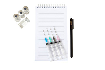 Notepad, pen, syringes, ampoules, insulation on a white background
