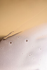 The texture of the shampoo running down the glass