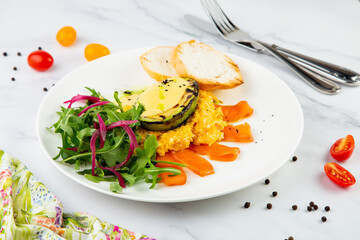 a mix of salmon, arugula salad, white bread and baked avocado with cheese. Light background