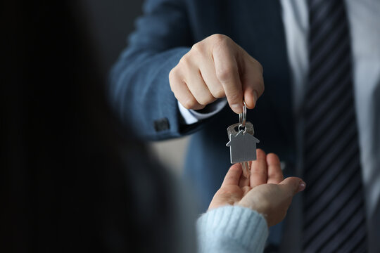 Businessman Hands Over House Keys To Client