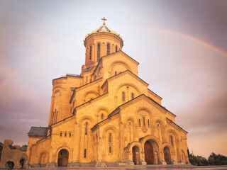 Panoramic view Tbilisi holy trinity cathedral with rainbow background