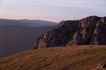 Evening mountain landscape, sunset pink-purple sky of Demerdzhi