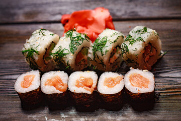 eating sushi roll delicacy food diet gourmet asian cuisine wooden background
