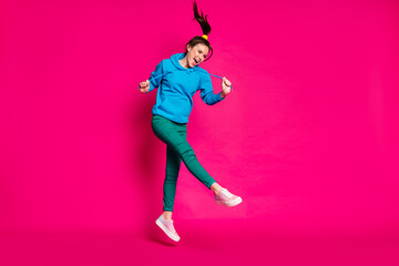 Fototapeta na wymiar Full size photo of young attractive lovely happy positive excited smiling girl jump look copyspace isolated on pink color background