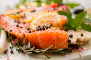 Fresh salmon fillets with spices ready for bakin
