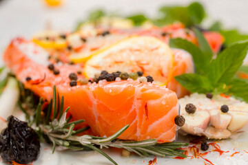 Fresh salmon fillets with spices ready for bakin