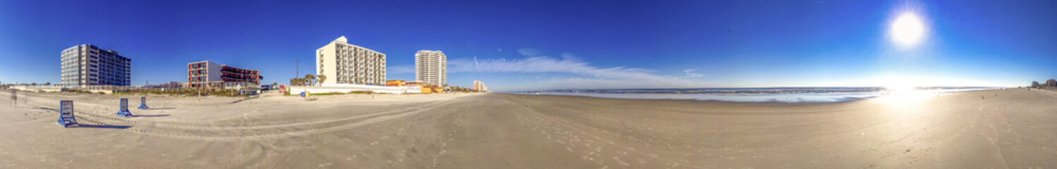 Fototapeta na wymiar Empty beach of Daytona Beach on a beautiful sunny winter day, Florida - Panoramic view