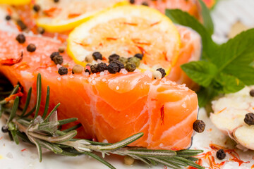 Fresh salmon fillets with spices ready for bakin