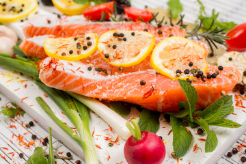 Fresh salmon fillets with spices ready for bakin