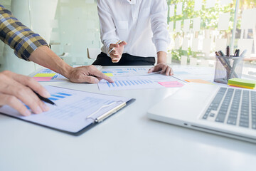 Business team meeting present. Professional investor working with new startup project. Digital tablet laptop computer design smart phone in office.