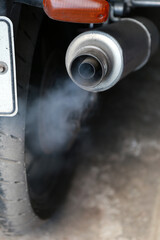 white smoke from motorcycle exhaust pipe