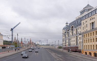  Along the streets moving pedestrians and vehicles
