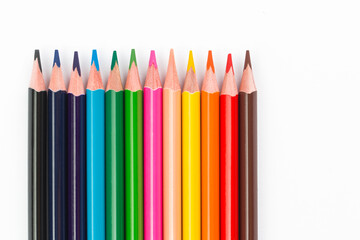 Colourful pencils on white background