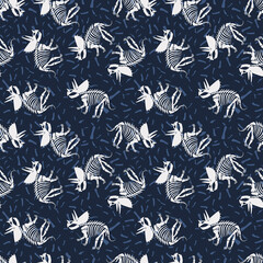 Vector triceratops seamless pattern with bones. Cute dinosaur skeletons on blue background. © Yana