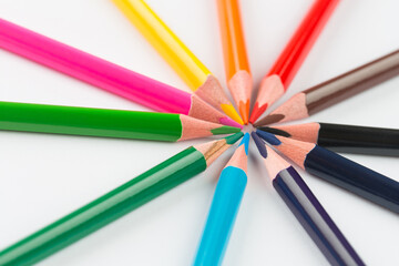 Colourful pencils on white background