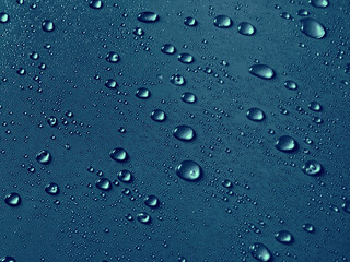 Random water drops on the blue PVC surface