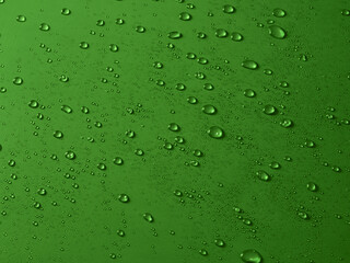 Random water drops on the green PVC surface