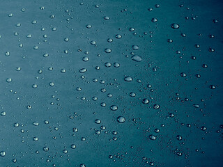 Random water drops on the blue PVC surface