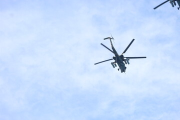 Fototapeta na wymiar military rocket helicopter over the sea.