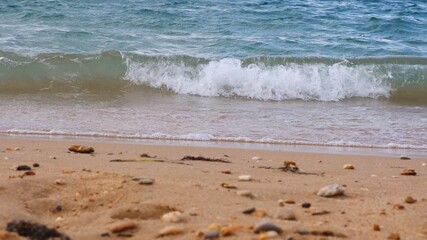 Image of a crashing wave on the blue sea.