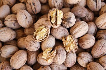 Walnuts with and without shells background of fresh walnuts.