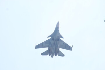 military supersonic fighter over the sea.