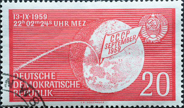  the Earth moon with stylized trajectory of Lunik 2, impact date and USSR national coat of arms. Reaching the surface of the moon by Lunik 2