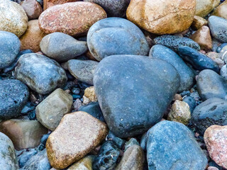 big wet stones on an beach 
