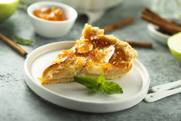 Traditional homemade apple tart with apricot jam