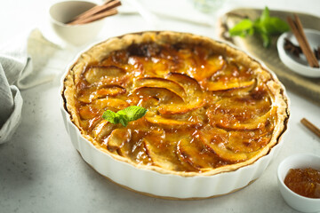 Traditional homemade apple tart with apricot jam